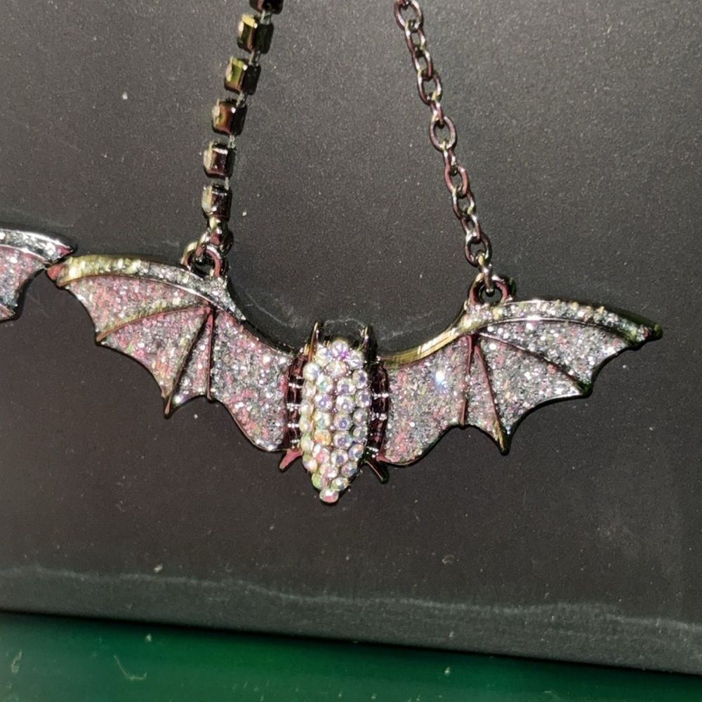 NWT Betsey Johnson sparkling, dangling bat earrings in gift box.